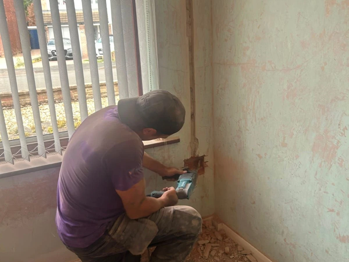 Fitting a socket back box beside a window during renovation work