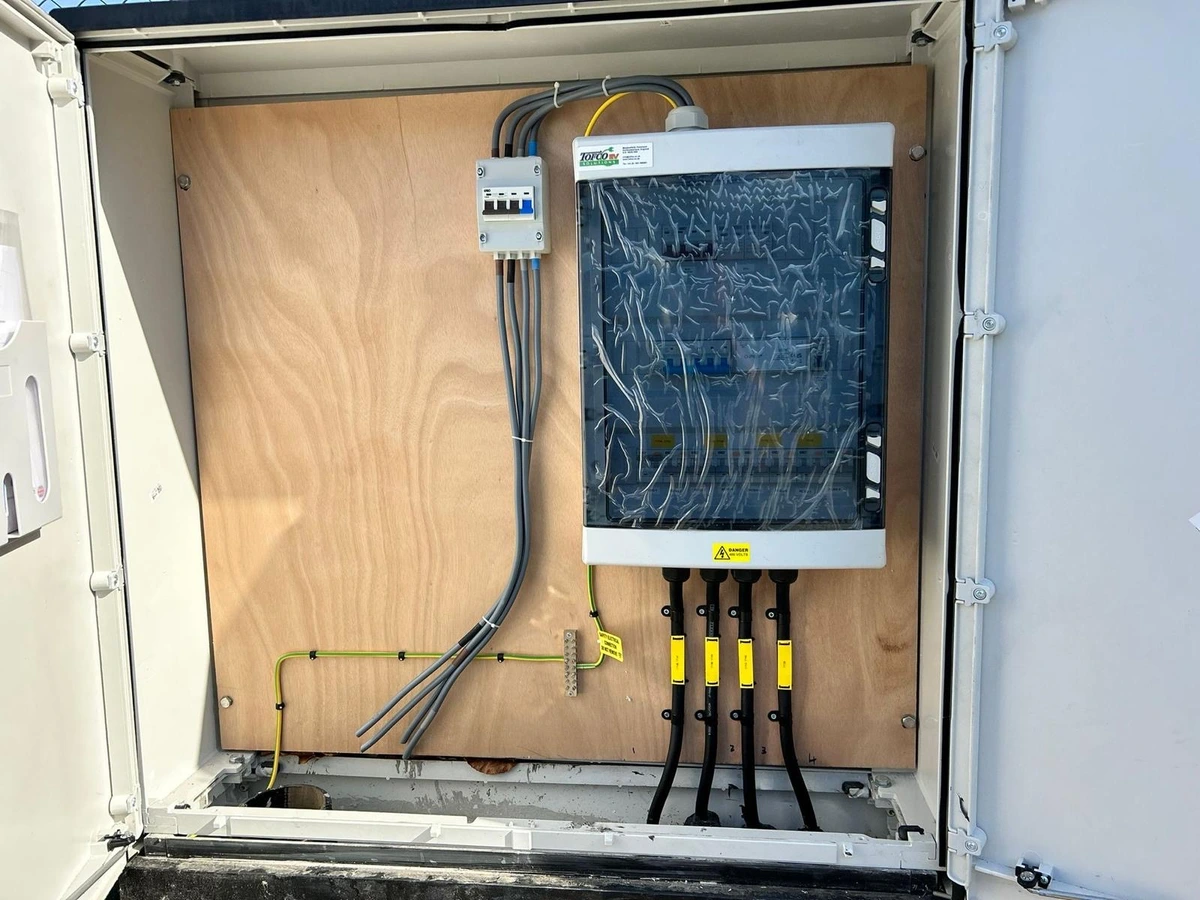 Outdoor distribution enclosure with glanded armoured cables and earth bar